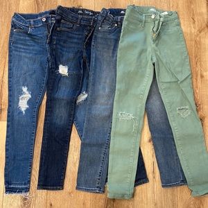 Four pairs of girls jeans.